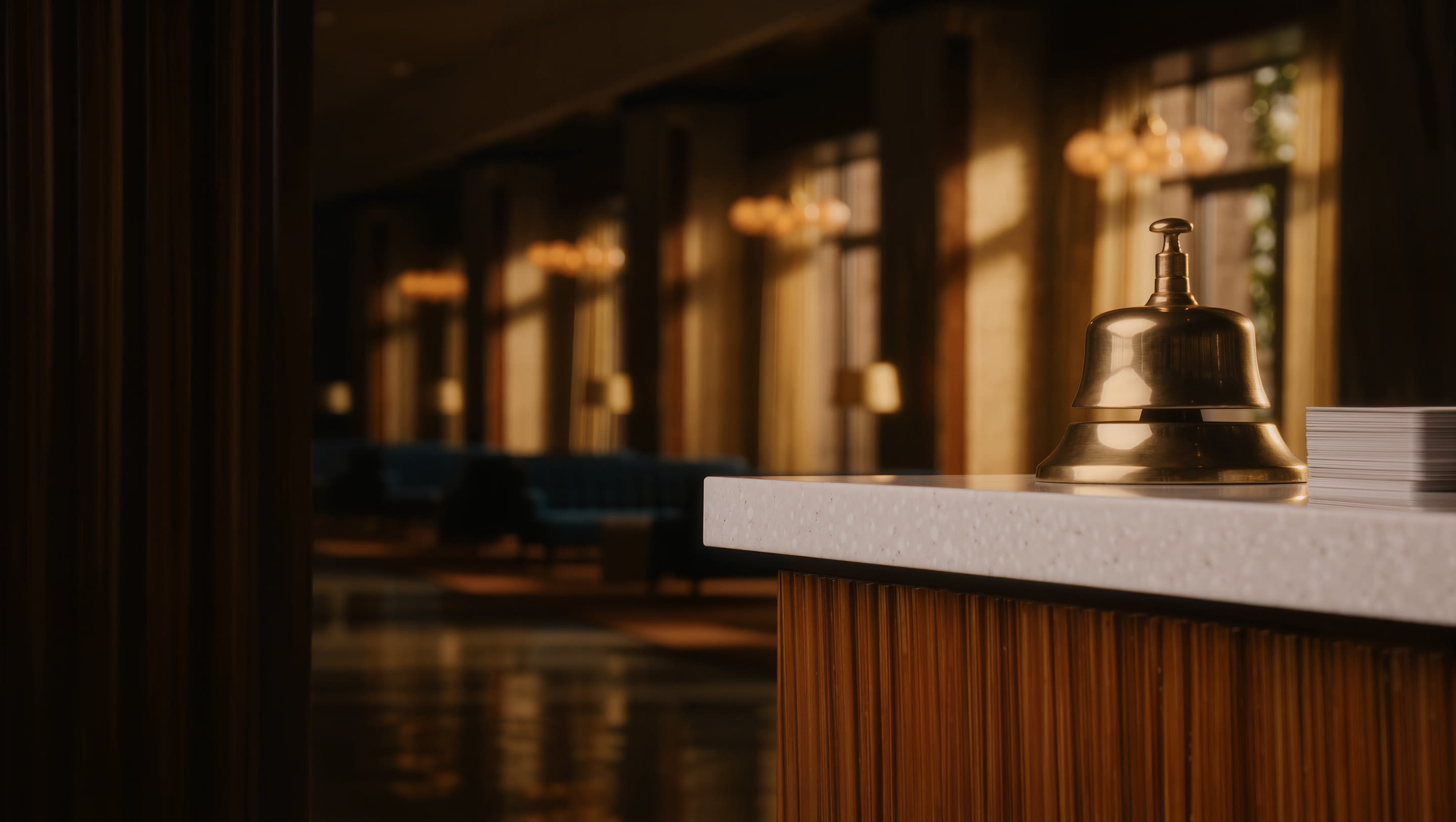 Brass service bell on a hotel front desk